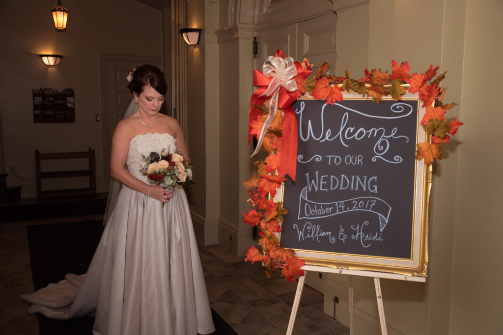 wedding photoshoot bride and sign